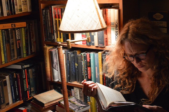 Author Elliott Holt reads from a first edition at Brazenhead Books.